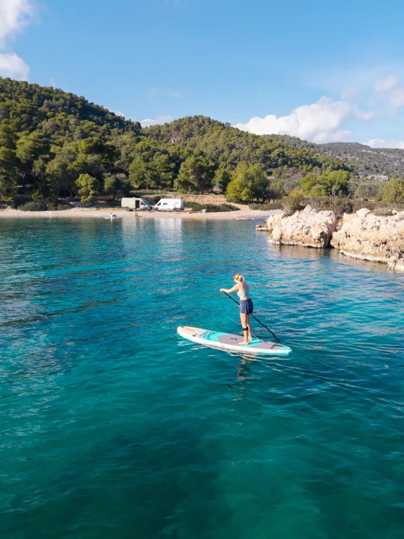 Jessica paddleboarding in crystal clear waters